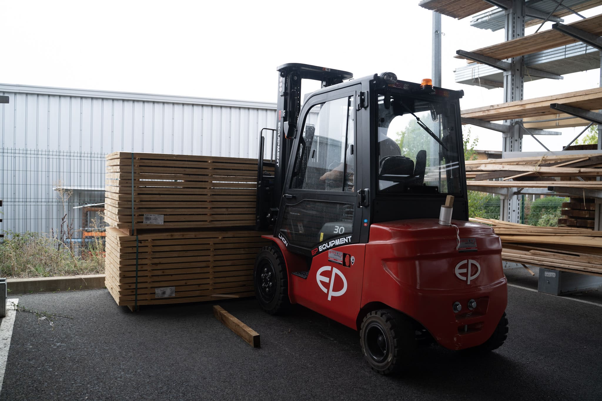 Electric forklift operating quietly in residential site
