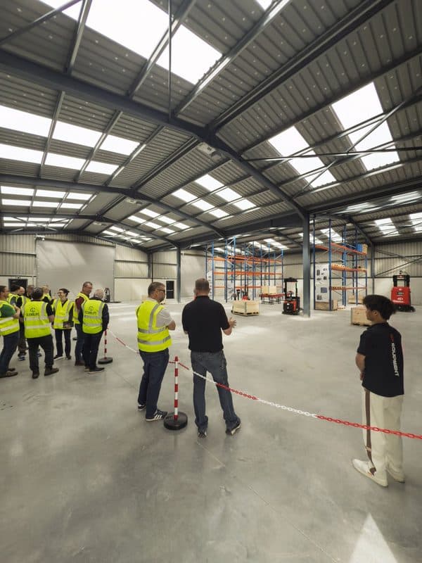 Visitors watching EP automated pallet trucks at a Clearlift demo day in Navan