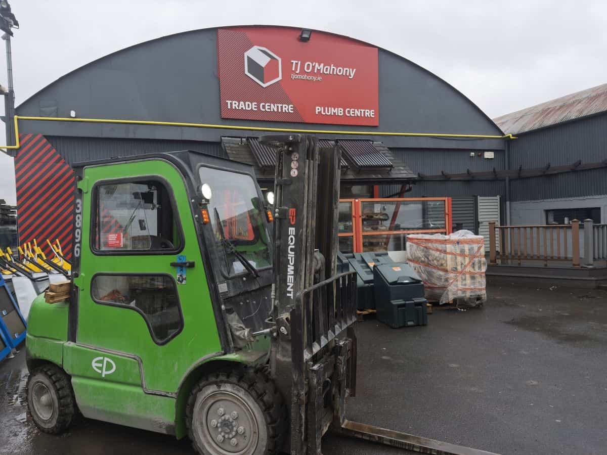 Green EP 30 lithium-ion cab forklift in the yard of an Irish builders merchant trade centre