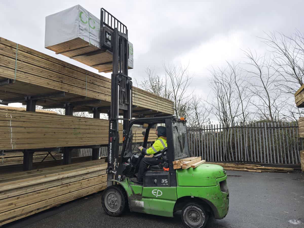 EP 35 lithium-ion forklift putting timber into an outdoor rack