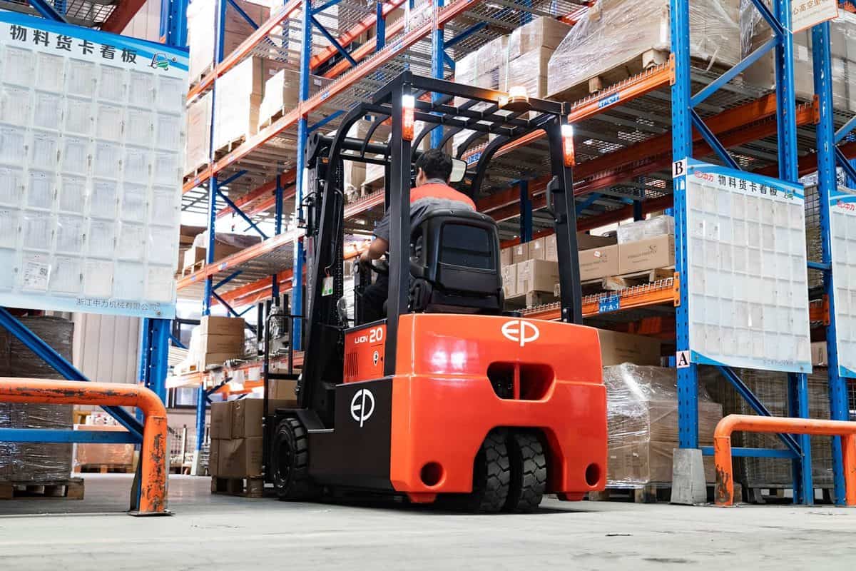 EP Li-ion three-wheel electric forklift in a warehouse aisle