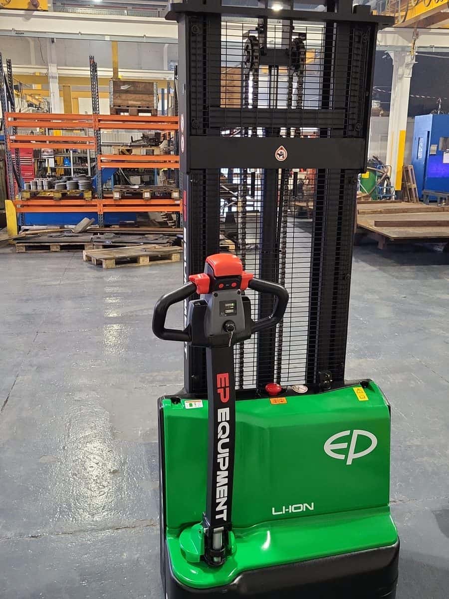 Green EP lithium-ion pallet stacker in a distribution warehouse