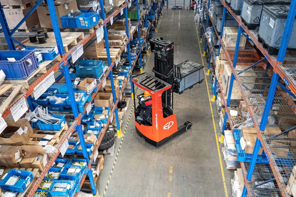 EP reach truck working in a narrow aisle between tall racking