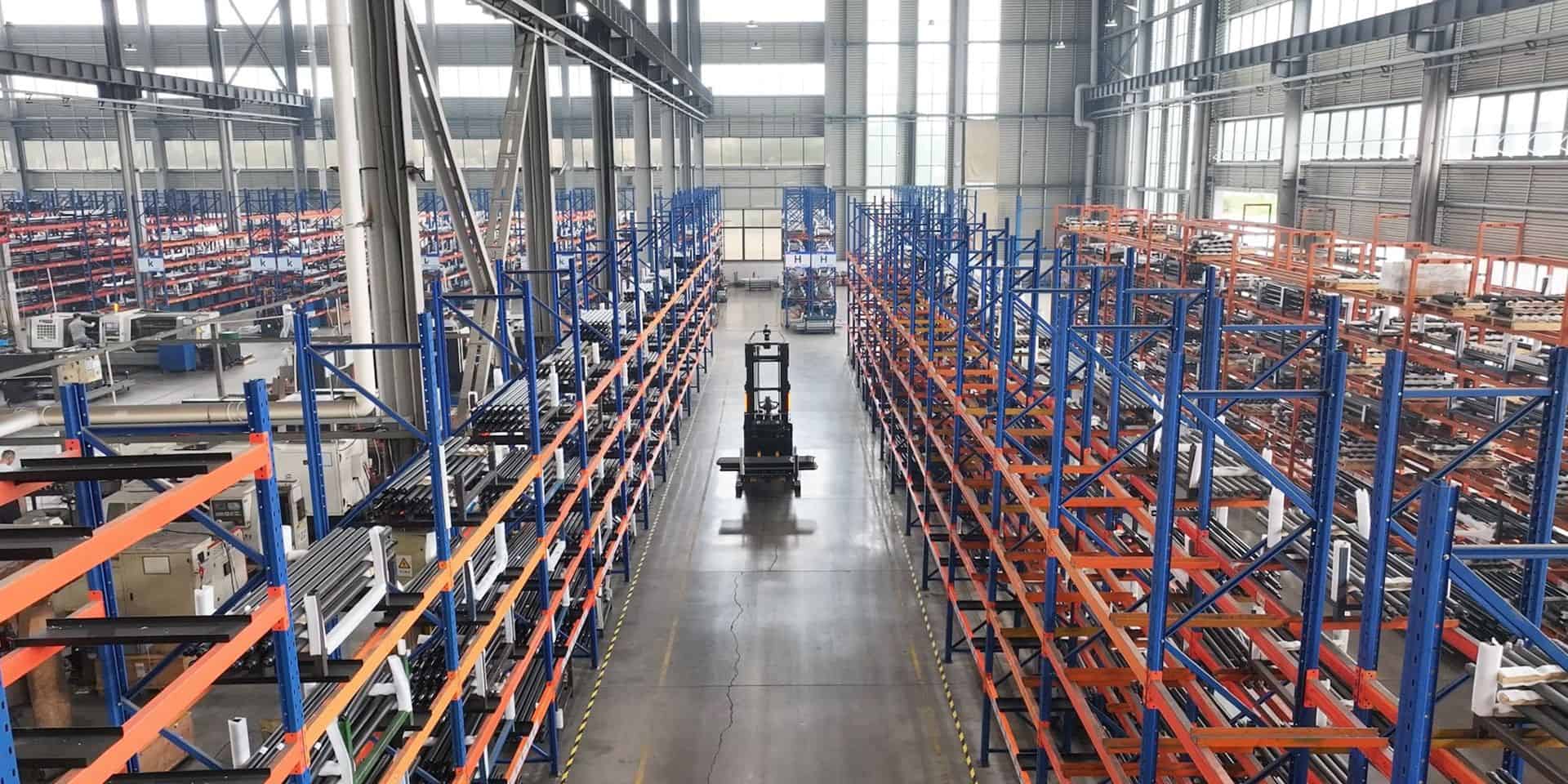 Bright distribution warehouse with long racking aisles