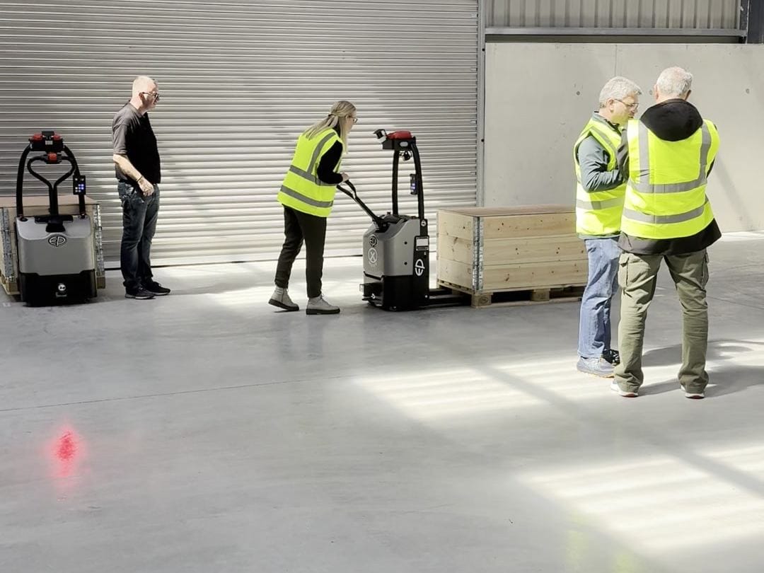 Clearlift team teaching an EP X-Mover automated pallet truck a route in Navan