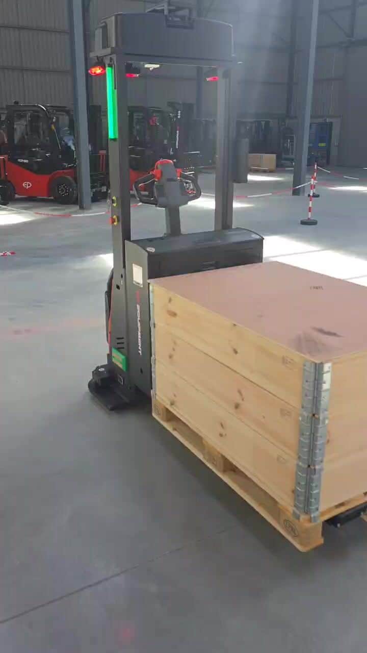 Close-up of an EP automatic stacker carrying a wooden crate